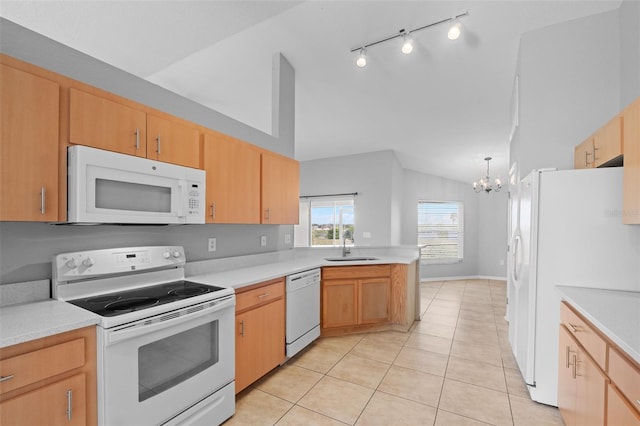 kitchen featuring sink, hanging light fixtures, an inviting chandelier, white appliances, and light tile patterned floors