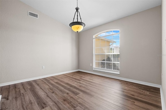 empty room with hardwood / wood-style floors