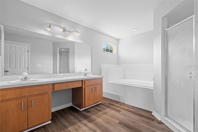 bathroom featuring wood-type flooring, vanity, and independent shower and bath