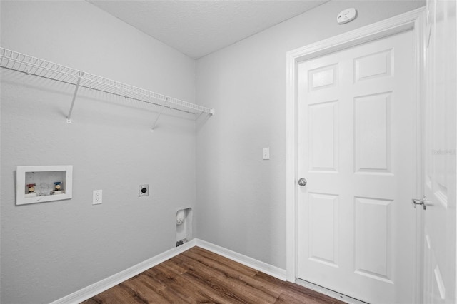 clothes washing area featuring hookup for an electric dryer, hookup for a washing machine, and hardwood / wood-style flooring