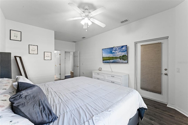 bedroom with ceiling fan and dark wood-type flooring