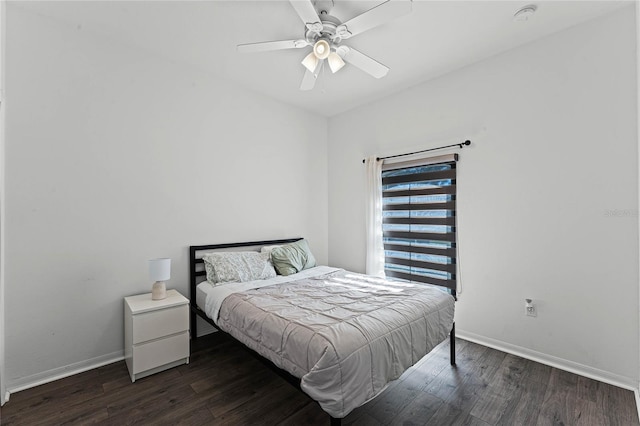 bedroom with ceiling fan and dark wood-type flooring