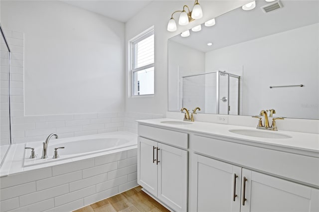 bathroom with vanity, plus walk in shower, and hardwood / wood-style floors