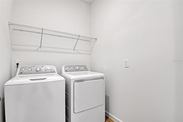 laundry area featuring washing machine and clothes dryer