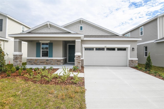 craftsman-style house featuring a garage, a porch, and a front lawn