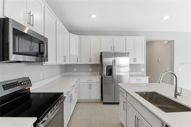 kitchen featuring white cabinetry, sink, and appliances with stainless steel finishes