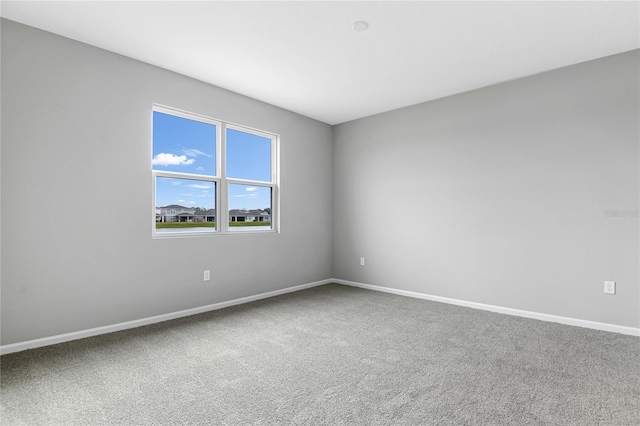 unfurnished room featuring carpet floors