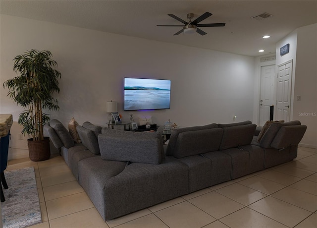 tiled living room featuring ceiling fan