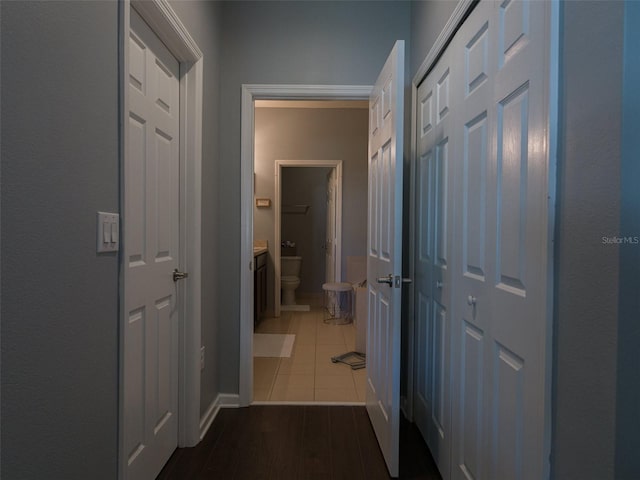 hall with dark hardwood / wood-style floors