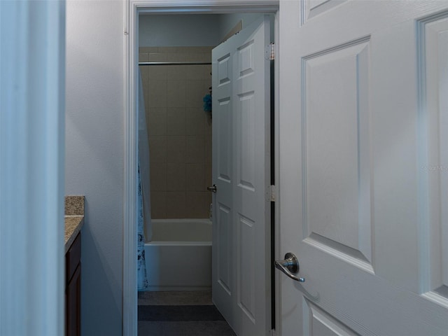 bathroom featuring vanity and shower / tub combo