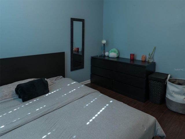 bedroom featuring dark hardwood / wood-style floors