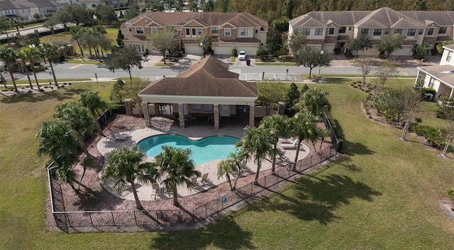 view of swimming pool with a yard and a patio