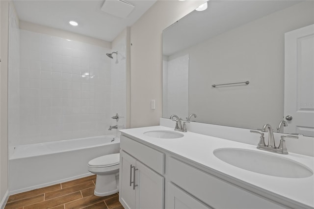 full bathroom with vanity, washtub / shower combination, and toilet