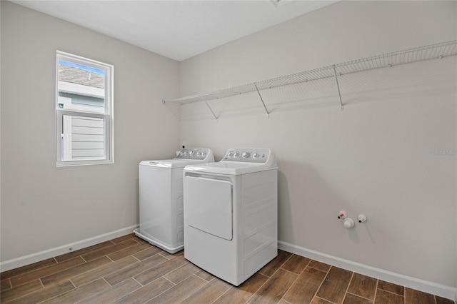 washroom with washing machine and clothes dryer