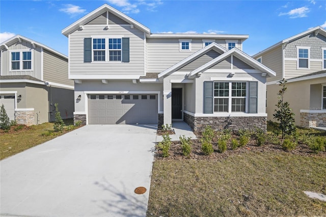 1479 August Gray Dr, Kissimmee, FL 34744 - craftsman-style home featuring stone siding, a garage, and concrete driveway