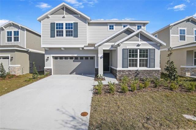 view of front of home with a garage and a front lawn