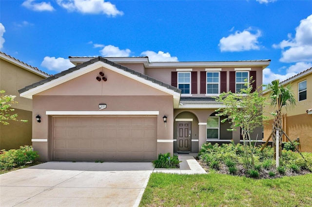 7635 Oakmoss Loop, Davenport, FL 33837 - view of front of property featuring stucco siding, a garage, and driveway