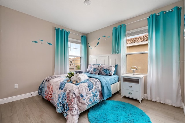 bedroom with light hardwood / wood-style flooring