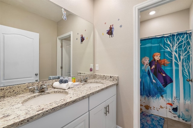 bathroom with tile patterned flooring, vanity, and a shower with shower curtain