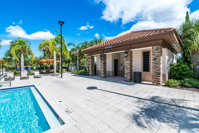 view of swimming pool featuring a patio area