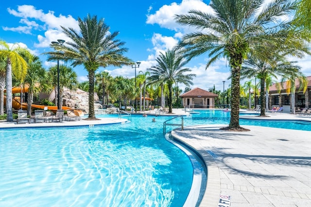 view of swimming pool with a patio area