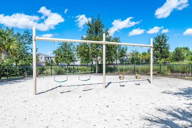 view of property's community with a playground