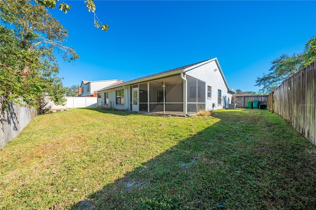 rear view of property with a lawn