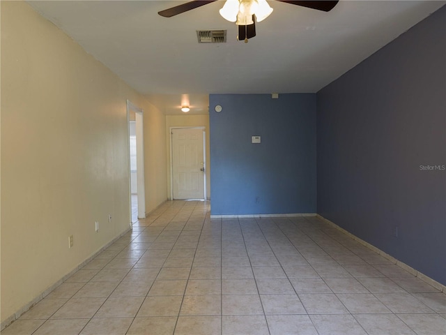 tiled empty room with ceiling fan