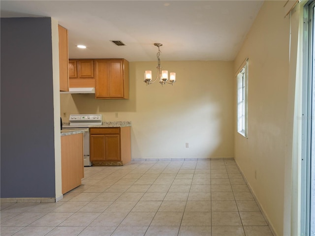 kitchen with electric range, light tile patterned floors, a notable chandelier, and hanging light fixtures