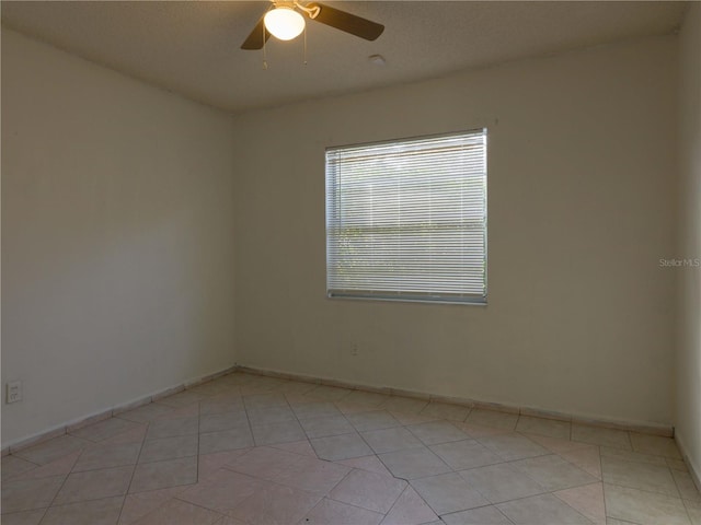 unfurnished room featuring ceiling fan