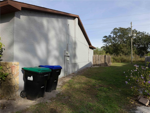 view of home's exterior with a lawn