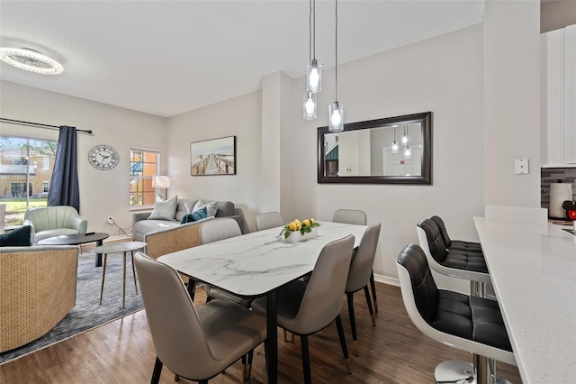 dining area featuring wood-type flooring