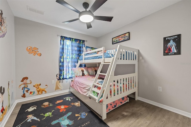 bedroom with ceiling fan and wood-type flooring