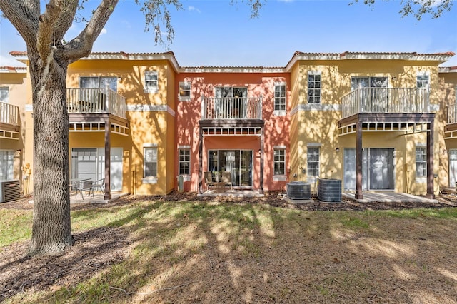 back of property with central AC unit