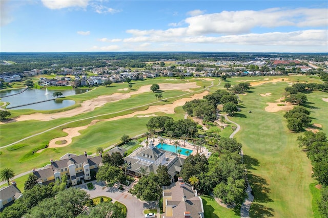 bird's eye view with view of golf course and a water view