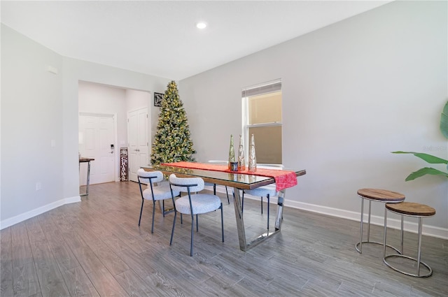 dining space featuring wood-type flooring