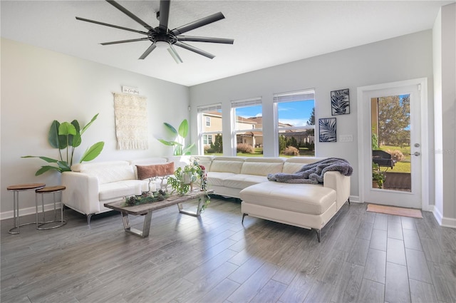 living room with hardwood / wood-style floors and ceiling fan