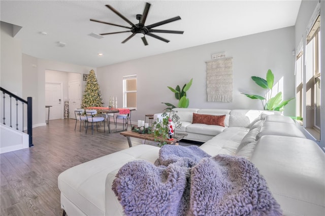 living room with ceiling fan and wood-type flooring