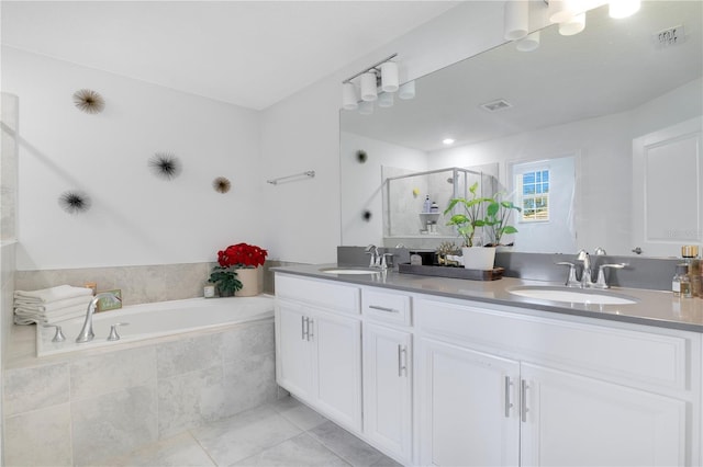 bathroom featuring vanity and shower with separate bathtub