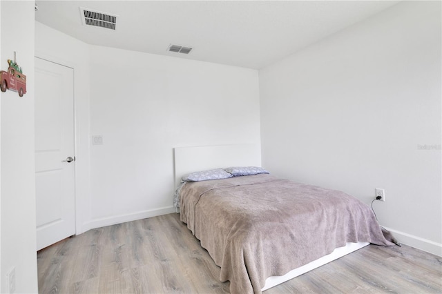 bedroom with light wood-type flooring