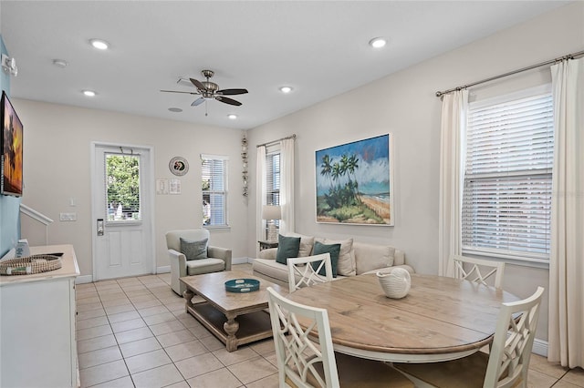 tiled dining space featuring ceiling fan