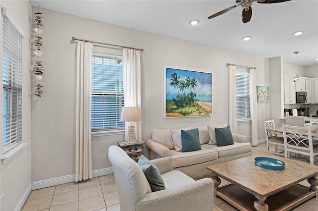 tiled living room with ceiling fan