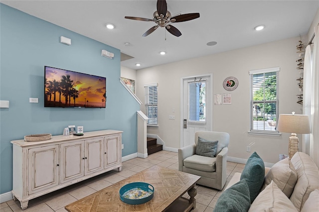 living room featuring ceiling fan and light tile patterned flooring