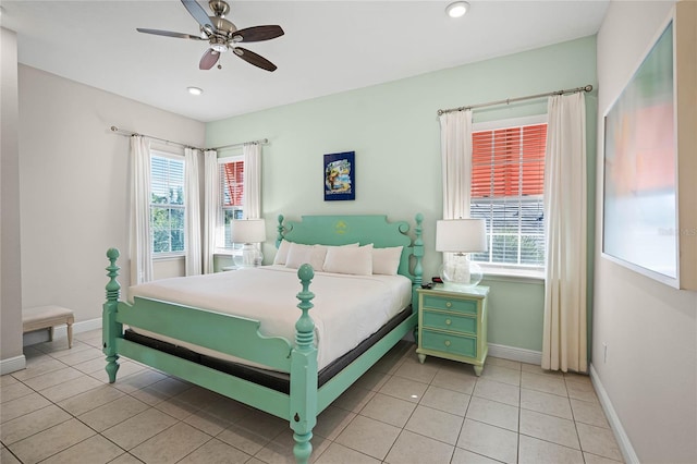 tiled bedroom featuring ceiling fan