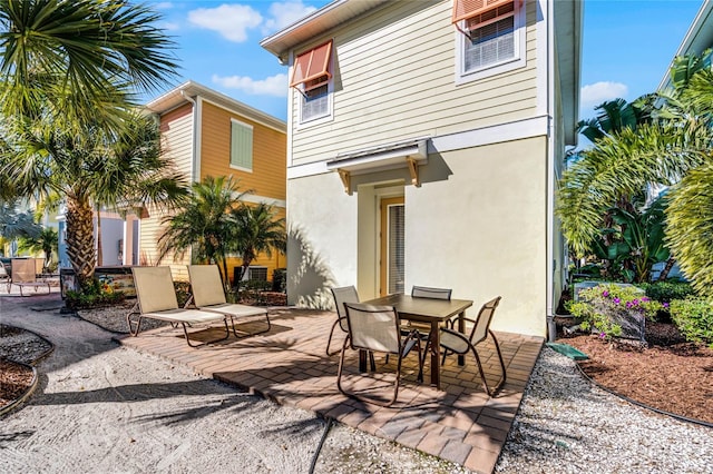 back of house with a patio area