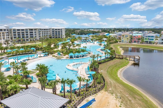 birds eye view of property with a water view