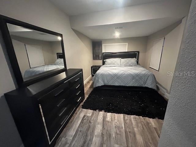 bedroom featuring wood-type flooring