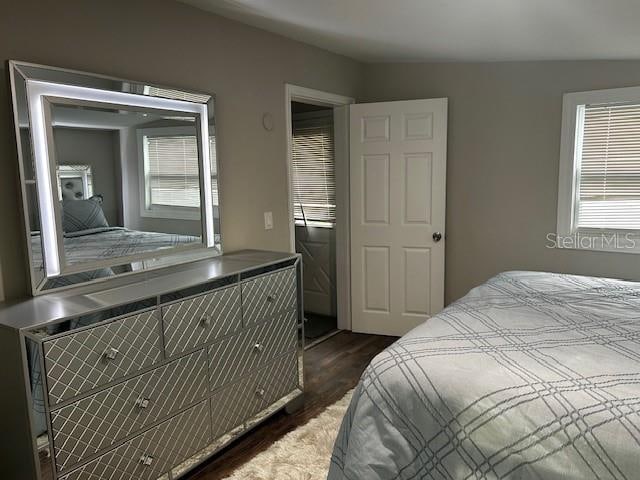 bedroom featuring dark wood-type flooring