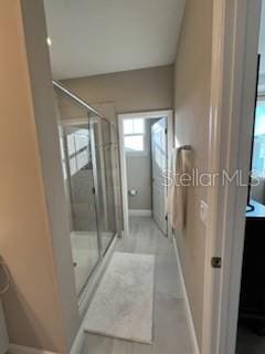 bathroom featuring an enclosed shower