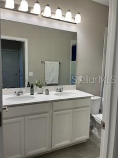 bathroom with vanity and toilet